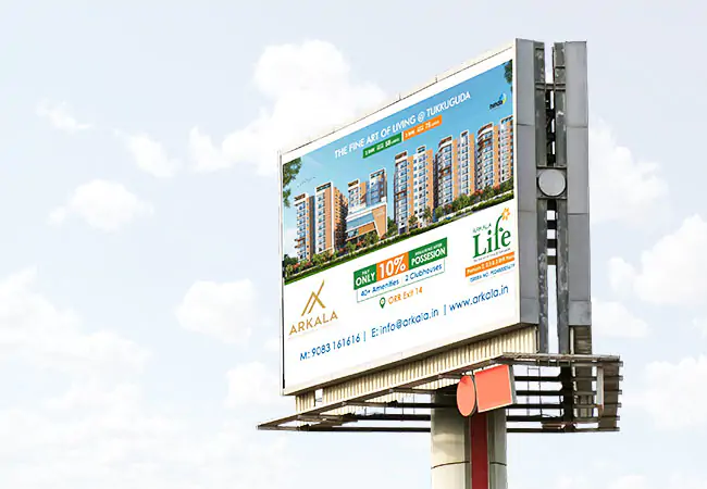 Outdoor billboard advertising Arkala Life real estate project at Tukkuguda, featuring high-rise apartments, promotional offers, contact details, and project highlights.